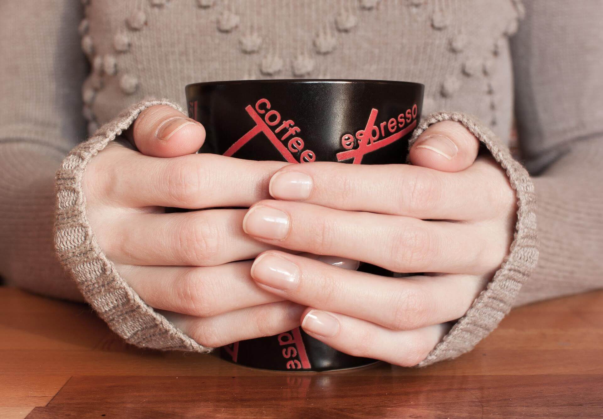 You're holding that mug wrong -- physicist calculates 'claw-hand posture'  is most effective to avoid coffee spills